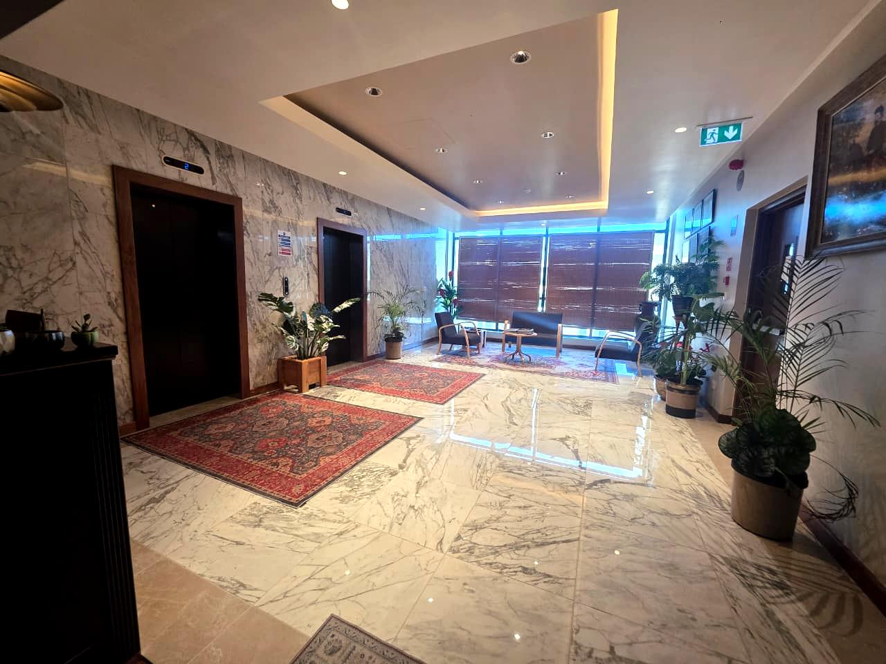 Marble reception hall on the private sixth floor